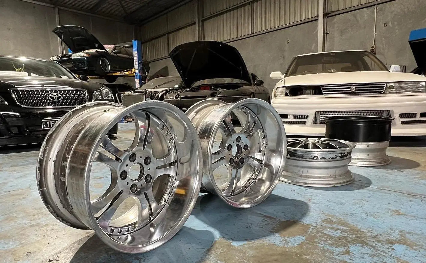 Baseley Automotive workshop with tyres and Japanese performance cars